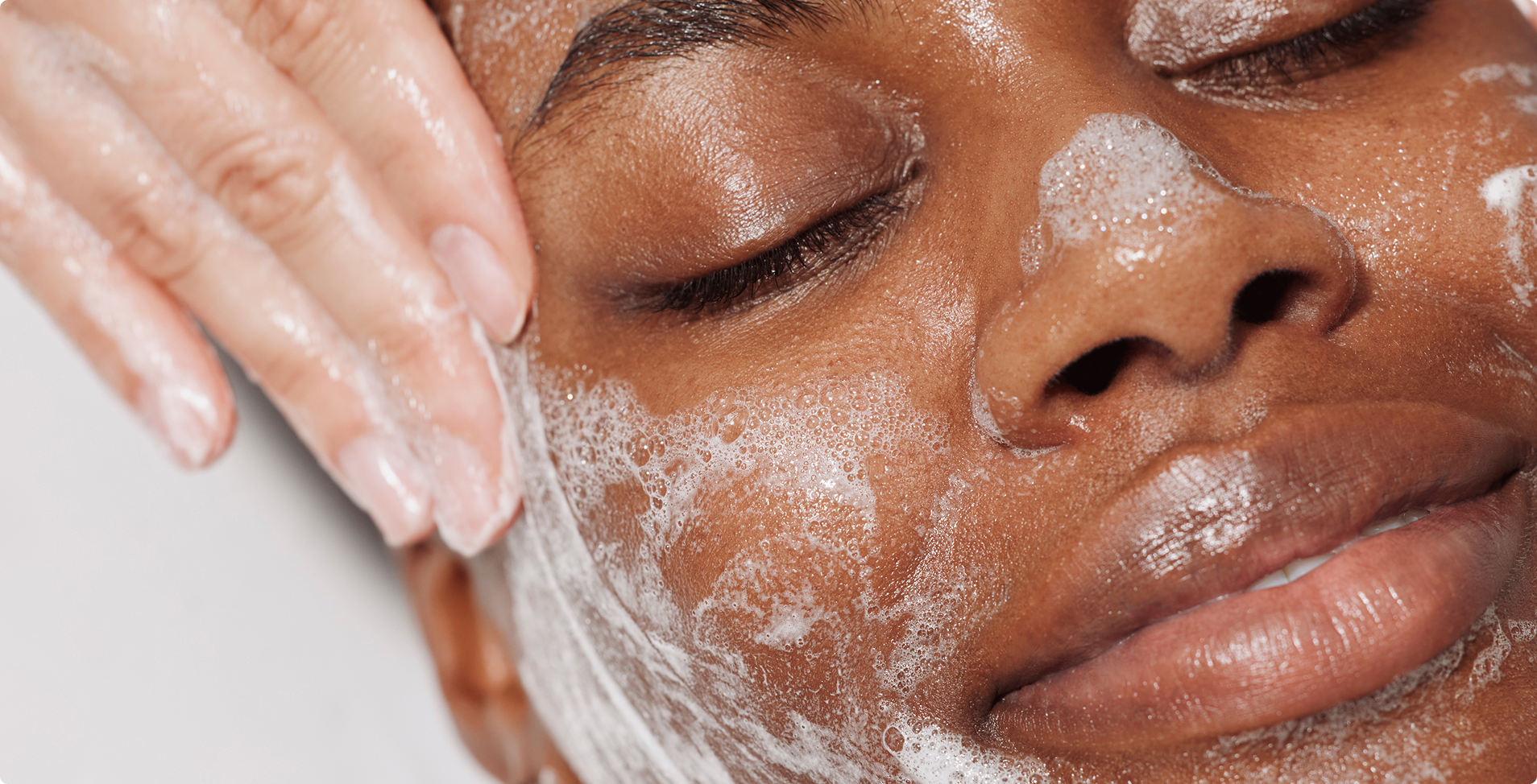 Heyday client getting their skin cleansed during a facical