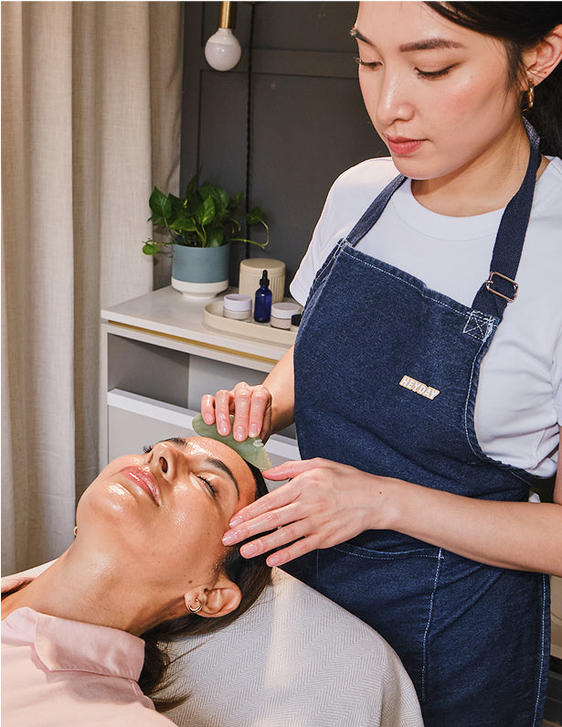 Licensed estheticians apply gua sha facial enhancement to reduce fine lines