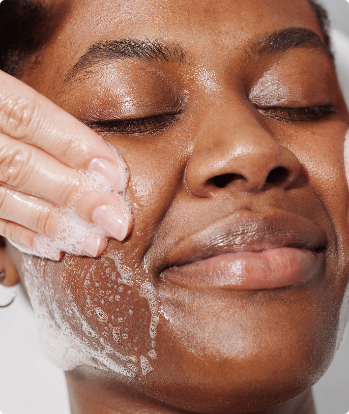 Heyday client getting their skin cleansed during a facical